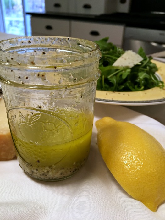 Top over arugula with fresh parmesan 