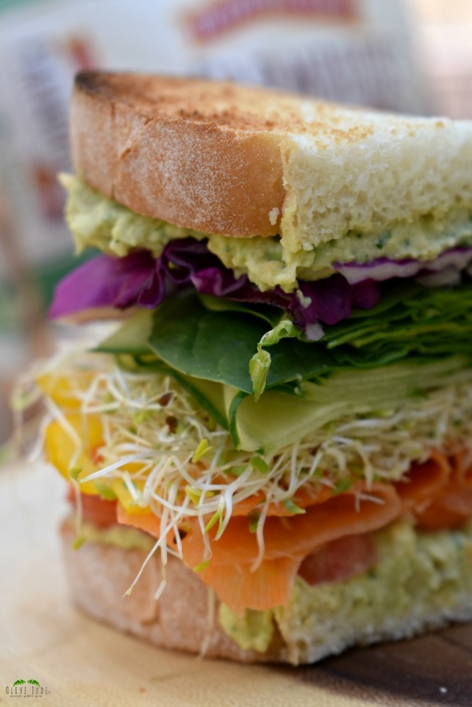 Colorful Veggie Sandwich with Chunky Chickpea Spread #BakedwithCare #FarmhouseBread #ad